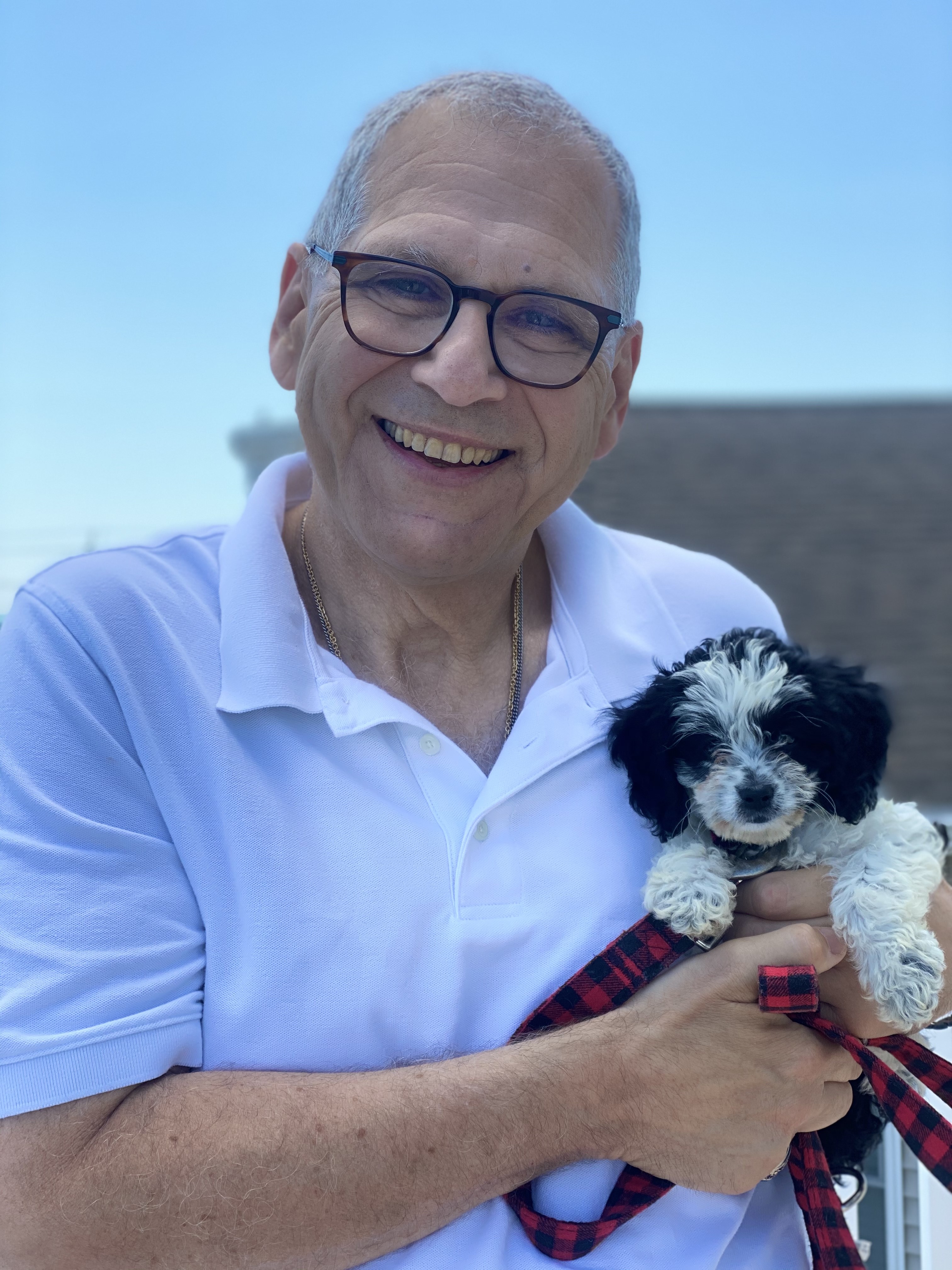 Dr. Heymann and his new puppy, Marti.