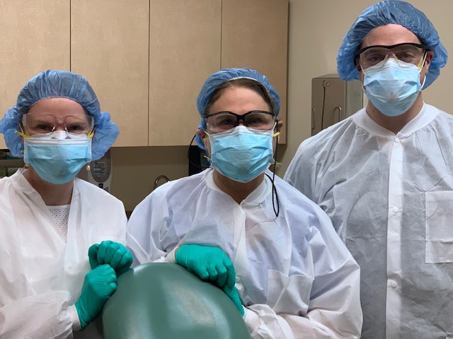 Authors Ashley Decker, MD, Naomi Lawrence, MD, and Henry Heaton, MD wearing PPE.