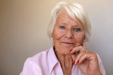Concerned woman with snowy white hair