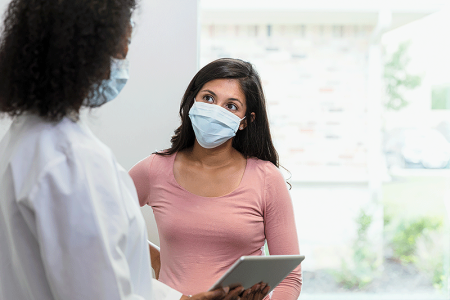 Dermatologist describing melasma treatment plan to patient